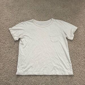 Butter yellow Brandy Melville pocket T-Shirt. Good condition